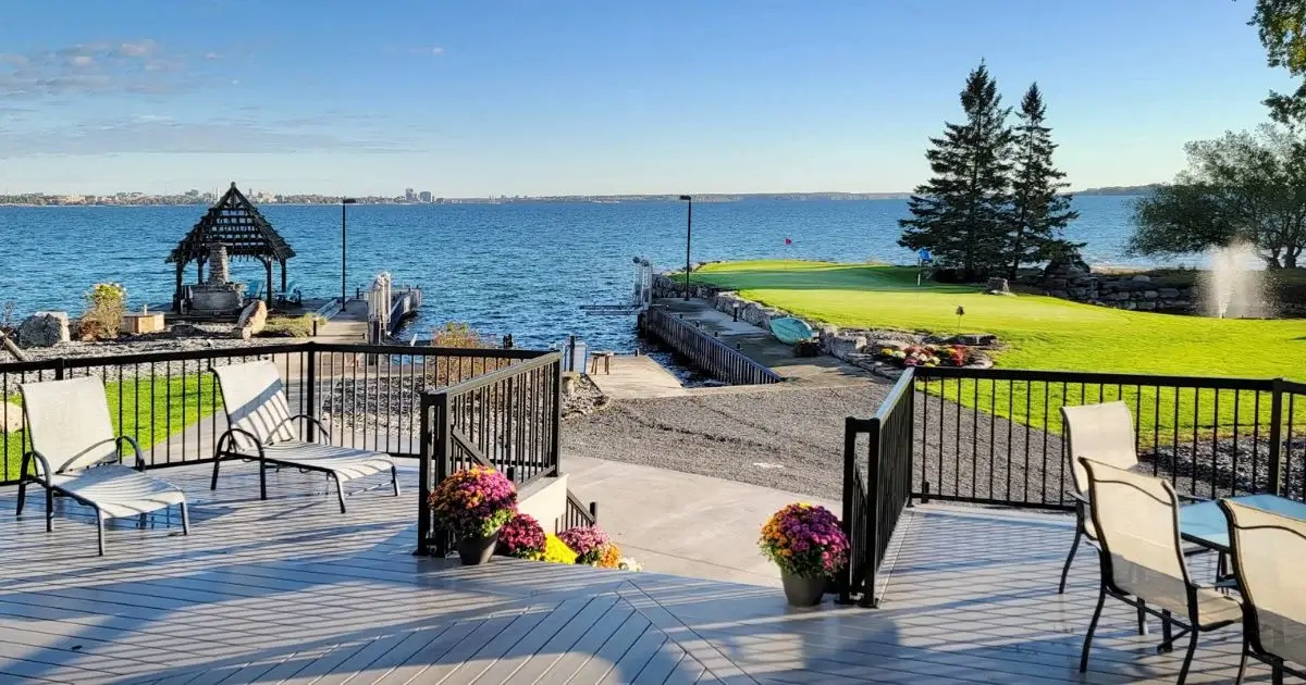 Private waterfront golf green and marina view
